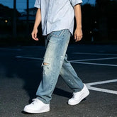 Distressed Tapered Jeans
